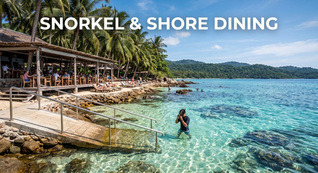 Visitor preparing to snorkel from the shore next to an oceanfront beach club restaurant